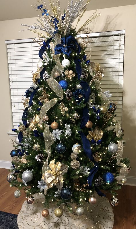 Blue And Gold Xmas Decor, Blue Christmas Tree With Ribbon, Christmas Tree Blue Silver And Gold, Blue Decoration Christmas Tree, Christmas Tree With Blue And Silver, Navy And Gold Christmas Tree Decorations, Good And Blue Christmas Tree, Navy Gold And White Christmas Tree, Blue Christmas Tree Ideas Color Schemes