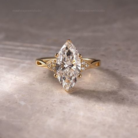 3CT Marquise Cut Lab Grown Diamond Cluster Split Band Engagement Ring, 10K Yellow Gold Unique Anniversary Ring, Promise Ring, Gift For Her  ▶ GEMSTONE DETAILS: ▷ Cut Type: Marquise Cut ▷ Carat weight: 3.02 CT ▷ Color Grade: G ▷ Clarity: VS1 ▷ Cut Grade: Excellent/Ideal ▷ Polish: Excellent ▷ Symmetry: Excellent ▷ Hardness: 10/10 ▷ Type: Lab-Grown Diamond (TYPE 2A/CVD) ▷ Certification: IGI/GIA ▶ SIDESTONE DETAILS: ▷ Cut Type: Round Cut ▷ Carat weight: 0.30CT ▶ JEWELRY METAL & OTHER DETAILS: ▷ Meta Wedding Ring Marquise Gold, Unique Marquis Engagement Rings, Marquis Yellow Gold Engagement Ring, Vintage Pear Engagement Ring Gold, Engagement Marquise Rings, Marquise Engagement Ring Platinum, Engagement Rings Silver Marquise, Wedding Rings Engagement Marquise, Diamond And Gold Ring