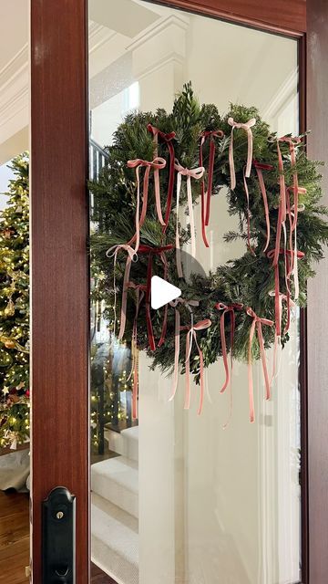 Monica Lavin on Instagram: "Since delicate ribbon bows are having quite the moment this season, I was inspired to make this chic wreath for my front door. I’m also obsessed with this darling velvet ribbon and linked the exact ribbon that I used in my profile. Share to inspire others ✨ #holidaydecor #artoftheentry #wreath #diy" All Year Door Wreath, Bow On Front Door Christmas, Front Door Wreath Christmas, Bow Christmas Wreath, How To Hang Christmas Wreaths On Door, Wreath Velvet Ribbon, Bow On Door Christmas, 2024 Wreath Trends, Christmas Bow Wreath