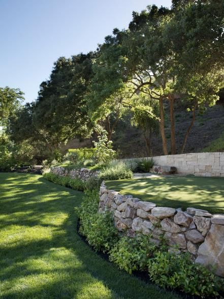 Outdoor Oasis | 2023 | HGTV Home On A Hill Landscaping, Landscape Design On A Hill, Garden Design On Hill, Steep Front Yard Landscaping Ideas, Terraced Driveways, Stone Wall Diy Outdoor, Cottage Retaining Wall, Retaining Walls Backyard, Layered Backyard Landscaping