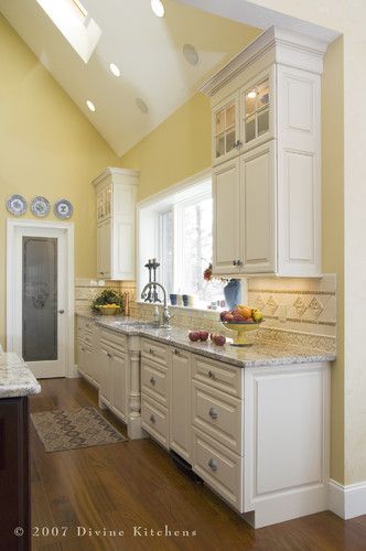 Yellow walls (different yellow), nice color for countertops Divine Kitchens LLC - traditional - kitchen - boston - Divine Kitchens LLC Yellow Kitchen Walls, Kitchen Color Yellow, Yellow Kitchen Designs, Trendy Kitchen Colors, White Cupboards, Kitchen Wall Colors, Kitchen Colour Schemes, Kitchen White, Kitchen Paint Colors