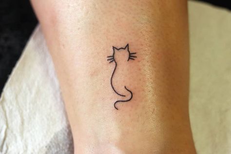 Cat Tattoo Designs Line Art, Black Outline Cat Tattoo, Tattoo Cat Outline, Outline Of A Cat Tattoo, Small Tabby Cat Tattoo, Cat Tattoo Outline Silhouettes, Simple Cat Line Art Tattoo, Sentimental Cat Tattoos, Cat Name Tattoo Ideas