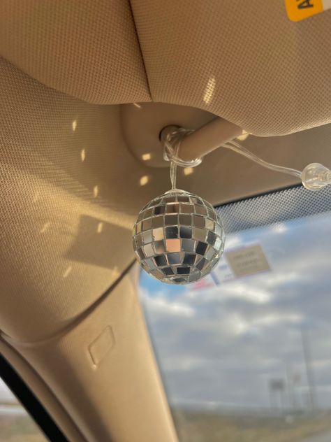 Cute Steering Wheel Covers Girly, Car Accessories Hanging, Mirrorball Car Decoration, Disco Ball In Car, Dream Car Decor, Girl Car Accessories Interiors, Car Interior Ideas Aesthetic, Car Interior Essentials, Girl Car Aesthetic Interior