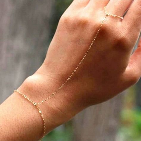 Offers Welcome *Sold Out At Free People. Get It Here! This Free People Delicate Gold Minimalist Hand Chain Slave Bracelet Is Made Of A 12k Gold Plated Chain That Closes With A Sturdy Lobster Clasp Closure. A Hand Chain Slave Bracelet Is A Bracelet And Ring Connected Together As One Making A Unique Boho Chic Style Look. Bracelet Length Is Approximately 7" Around Wrist With Extender So You Can Make It Longer Or Shorter. Gold Hand Chain, Aztec Bracelet, Coin Charm Bracelet, Hand Chain Jewelry, Seashell Bracelet, Gold Pearl Bracelet, Gold Heart Bracelet, Hand Chain Bracelet, Bracelet And Ring