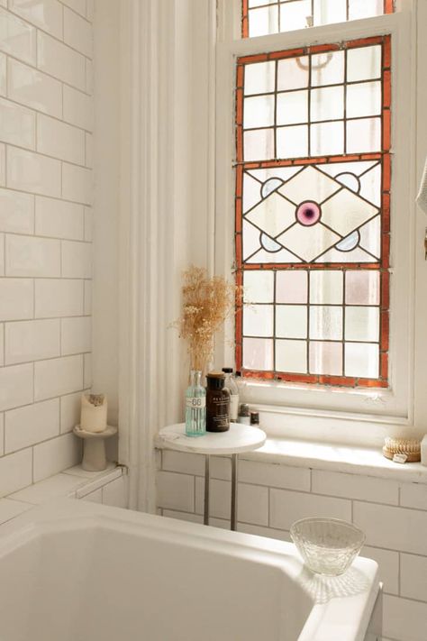 50 Small Bathroom Ideas to Zhuzh Your Tiny Space | Apartment Therapy Faux Window Bathroom, Bathroom With Stained Glass Window, Stained Glass Windows In Bathroom, Privacy Bathroom Window, Stained Glass Bathroom Door, Bathroom Stained Glass Window, Stained Glass Window Bathroom, Stained Glass In House, Window In Shower Ideas