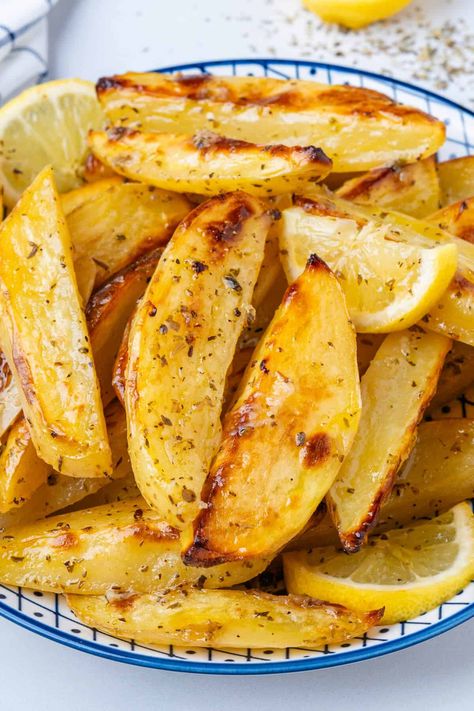 These Greek Lemon Potatoes aren't your regular potatoes. Roasted in a lemony broth, they're soft and tender with crispy edges. This is a side dish to impress! Greek Potatoes Easy, Greek Oven Potatoes, Greek Roast Potatoes, Greek Oven Roasted Potatoes, Best Greek Potatoes Recipe, Greek Baked Potatoes, Greek Style Lemon Roasted Potatoes, Authentic Greek Potatoes, Jimmy The Greek Potatoes