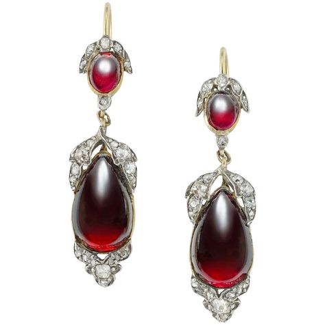 A pair of Victorian garnet and diamond drop earrings, each earring consisted of an oval cabochon garnet with diamond-set leaves above, suspending a pear-shape cabochon garnet with similar foliate Victorian Gold Earrings, Antique Gold Earrings, Character Clothing, Victorian Earrings, Georgian Jewelry, Diamond Decorations, Diamond Cluster Earrings, Edwardian Jewelry, Garnet And Gold