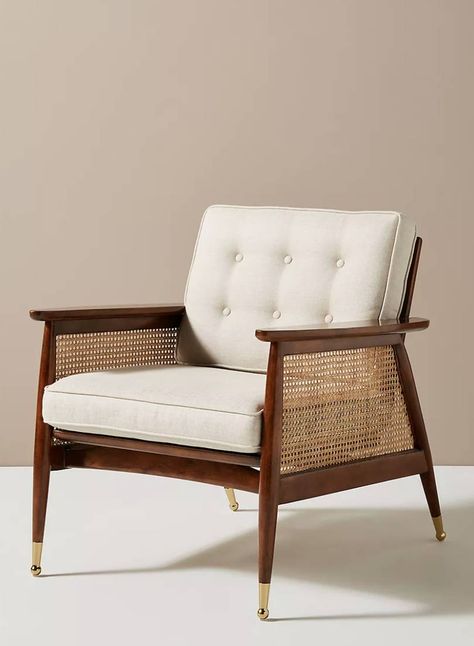 Walnut finish 'Nadia' caned armchair, £698 at Anthropologie. A very elegant chair by Anthropologie with its rich walnut veneer and brass accents, and those caned arms will never go out of style. [button url="https://www.anthropologie.com/en-gb/shop/nadia-caned-accent-chair?color=012&type=REGULAR&size=One%20Size&quantity=1"]Shop now[/button] Cane Webbing Chair, Rope Chair, Hanging Furniture, Cane Furniture, Anthropologie Uk, Cane Chair, Modern Accent Chair, Furniture Hacks, Room Decorations