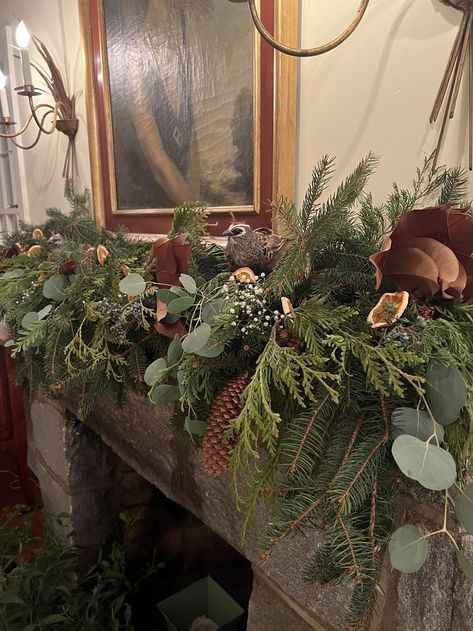 As a Christmas decor idea, consider using natural elements. Layers of greenery, pinecones and dried citrus make this mantle feel fresh and festive ��— but the special touch is the birds that rest on top. Natural decor is timeless, sure to come out each year - discover our curated selection of holiday decorations with flora and fauna. Botanical Christmas Decor, Garland On Mantle Christmas, Foraged Christmas Decorations, Garland On Mantle, Woodsy Christmas, Xmas Inspiration, Christmas Decor Idea, Dried Citrus, Christmas Fireplace Mantels