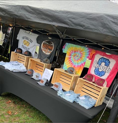 How To Display Shirts For Sale Craft Fairs, Selling Shirts Display, Displaying Shirts At Craft Show, Craft Fair Shirt Display, Winter Wonderland Vendor Booth, Shirt Vendor Display, Clothing Craft Fair Display, Music Festival Vendor Booth Ideas, Tshirt Display Ideas Booth Market