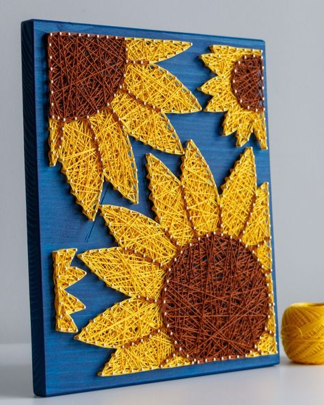 🌻 Happy Friday, everyone! 🌻 Here comes our last sunflower to rule them all - the large size! 🌻 If you ever needed a piece of sunshine in your interior, this string art sunflower will definitely bring you some! ☀️ Positive vibes while crafting and guaranteed after hanging on the wall. 🌻✨ #StringArtSunflower #PositiveVibes #BringingSunshine #StringArt #Craftkitforadults #sunflowerart Sunflower Diy Crafts, 4h Project Ideas, Zodiac Crafts, Sunflower String Art, String Art Flower, Sunflower Craft, Africa Artwork, Twine Crafts, Sunflower Crafts