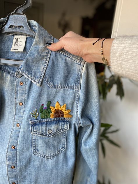 Cactus and sunflower embroidered on denim shirt Cactus And Sunflower, Embroidery Cactus, Denim Jacket Embroidery, Embroidery Jeans Jacket, Jean Diy, Embroidered Denim Shirt, Diy Denim Jacket, Clothes Embroidery Diy, Embroidered Jean Jacket