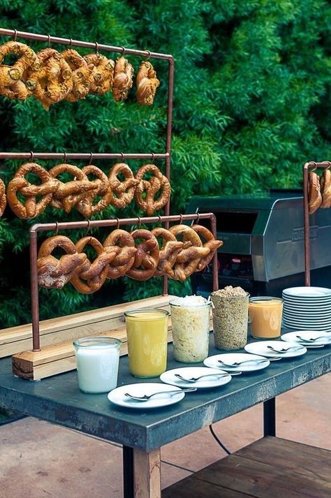 Creative Food Stations/Soft Pretzels Set up a self-serve smorgasboard with a variety of soft-pretzel varieties and dipping sauces, like whole-grain mustard, melted cheese or queso, and even sweet toppings like cinnamon sugar and hot fudge. Wedding Buffets, Wedding Pretzels, Pretzel Bar, Cocktail Hour Food, Pretzel Bars, Wedding Food Stations, Donut Bar, Pipe Decor, Oktoberfest Party