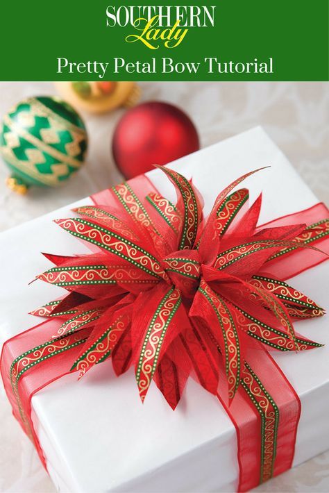 Add some sparkle and splendor to your holiday gifts with a pretty poinsettia-inspired bow. See our step-by-step tutorial here! Diy Wreath Bow, Christmas Bows Diy, Homemade Bows, Bows Diy Ribbon, Southern Lady, Gifts Wrapping Diy, Creative Diy Gifts, Gift Wrapping Bows, Creative Gift Wrapping