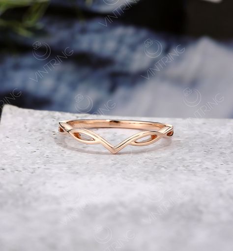 Curved Wedding Band, Plain Wedding Band Women, V Shape Band, Infinity Band Ring, Half Twist Ring, Simple Band For Her, Solid Rose gold Ring  Plain Wedding band Metal: Yellow Gold/Rose Gold/White Gold Metal Purity: 14K/18K * Main stone can be personalized per request and budget. The Ring can be made with Diamonds, Moissanite, Alexandrite, Morganite, Aquamarine and more. * Customization: Feel free to request a custom order. * Installments: I offer payment plans.  * It takes 3-4 weeks to create the jewelry. All the jewelry is made to order. Orders can be expedited. * Sizes available: 3 US - 9 US. If you are interested in plus size ring from 10 US- 14 US Please let me know. * All the jewelry can be made in the following metals per your request: 14k Yellow/ Rose or White gold, 18K Yellow/ Rose Curved Wedding Bands For Women, Simple Rose Gold Wedding Ring, V Wedding Band, Modern Gold Rings With Curved Design, Simple Wedding Bands For Women, Rose Gold Wedding Band, Rose Gold Wedding Ring, Simple Curved Wedding Band, Modern Gold Curved Rings