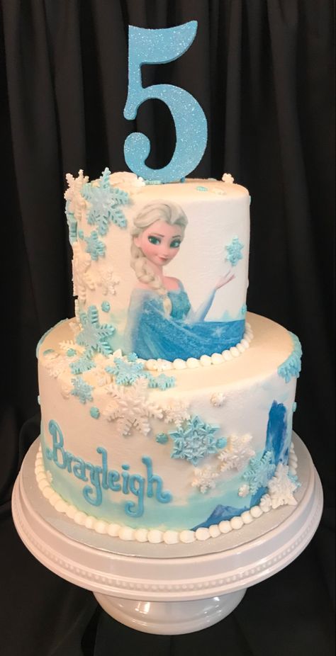 Two Tier Elsa Cake, Two Tier Frozen Cake Birthday, Elsa Cakes For Girls Birthday, Elsa Frozen Birthday Cake, Elsa Cake Design, Frozen Cake Ideas, Elsa Birthday Cake, Frozen Birthday Party Cake, Frozen Themed Birthday Cake