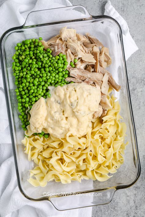 Make this creamy and flavorful chicken noodle casserole for dinner tonight. It is so easy to whip up this casserole, all it takes to make the filling is some chicken, a can of cream of chicken soup, some peas, and milk. Then it is topped with breadcrumbs, cheese, and butter. Prepare it ahead of time and have it ready to bake in the oven. So quick, creamy, cheesy, and delicious. #chickennoodlecasserole #easychickennoodlecasserole #chickencasserole #spendwithpennies Dinner Ideas Easy Quick Busy Mom Families Weeknight Meals, Leftover Chicken Recipes Casserole, Easy Dinner With Rotisserie Chicken, Rotisserie Chicken Recipes Leftover Easy, Chicken Skillet Meals, Chicken Noodle Casserole Easy, Cassarole Meals, Easy Chicken Noodle Casserole, Pasta Peas