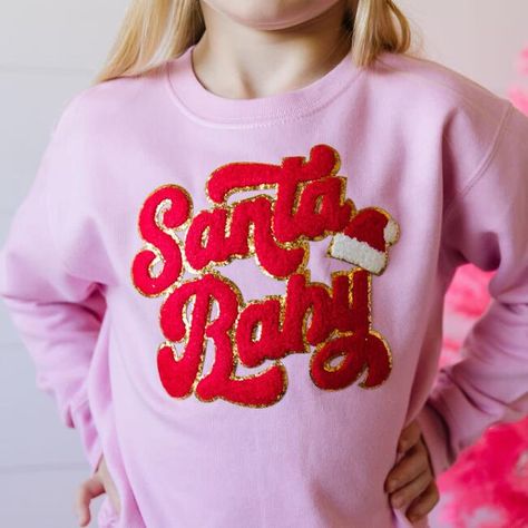 The Santa Baby Patch Christmas Sweatshirt is a fun and festive sweatshirt for celebrating Christmas! Crewneck Color: Pink, Patch Color: Red and white chenille with gold glitter outline. Features: Tagless inside neck label for an itch-free wear; cozy fleece lining. Fit: Toddler Unisex; True to Size. Each sweatshirt is hand pressed with love in our hometown warehouse. | Sweet Wink | Santa Baby Patch Christmas Sweatshirt, (Pink, Size 2Y) | Maisonette collects the best children’s products from aroun Christmas Tutu, Pink Patch, Trendy Shirt Designs, Celebrating Christmas, Holiday Sweatshirt, Neck Label, Santa Baby, Pink Sweatshirt, Pink Christmas