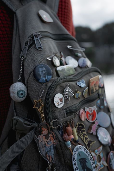 Fashion: #fashion, #style, #outfitinspiration, #beauty Messenger Bag Outfit Aesthetic, Backpack With Pins Aesthetic, Pins On Bag Aesthetic, Goblincore Backpack, Messenger Bag With Pins, Bag With Pins Aesthetic, Decorated Backpack, Punk Backpack, Backpacks Aesthetic