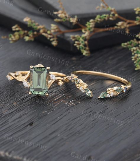 Emerald cut Green Sapphire engagement ring set 14k gold vintage moss agate wedding band marquise cut diamond bridal promise Anniversary ring 【Ring Details】 Engagement Ring ✦Main stone:Lab Green Sapphire ✦Shape: Emrald cut ✦Size: 9*6 mm ✦Side stones: Moissanite or Natural Diamonds ✦Carat: Approx 0.14 ct Wedding Band ✦Stones: Moissanite or Natural Diamonds/moss agate/Lab Alexandrite ✦Shank width: 1.8 mm/1.3mm ✦Metal: 925 sterling silver (Rose gold/Gold plated) and Solid 14 K/18 K gold(Rose gold/Wh Gold Rings With Emeralds, Wedding Ring With Gemstone, Wedding Rings Engagement Sets, Nouveau Engagement Ring, Emerald Gold Ring Engagement, Marquise Green Engagement Ring, Silver Engagement Rings Diamond, Vintage Engagement Rings Not Diamond, Rings Engagement Colored Stones