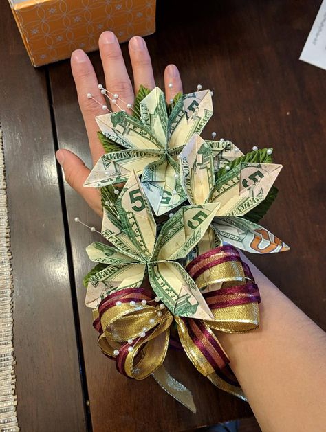 Money wrist corsage.  Flowers made with $50’s and 1 a $100 Money Corsage, Graduation Corsage, Money Wreath, Graduation Leis Diy Ribbons, Corsage Flowers, Money Folding, Lei Graduation, Lei Ideas, Graduation Leis Diy