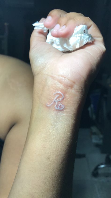 White tattoo letter R J And R Tattoo, The Letter R Tattoo, R Tattoo Letter Initial, Letter R Tattoo Ideas, R Letter Tattoo Design, R Tattoo Letter, Letter R Tattoo, R Letter Design, Ganpati Songs