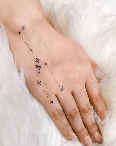 52 Gorgeous Taurus Tattoos with Meaning - Our Mindful Life Celestial Taurus Tattoo, Earthy Taurus Tattoo, Taurus Astrology Tattoo For Women, Taurus Earth Sign Tattoo, Pretty Taurus Tattoo, Aries Constellation Hand Tattoo, Taurus Tattoo Star Constellation, Tattoo Ideas Astrology Taurus, Taurus Zodiac Constellation Tattoo