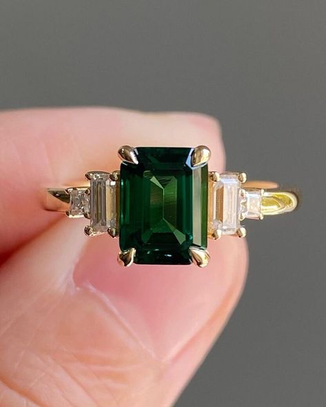 Five Stone Art Deco Diamond Ring, 2CT Green Emerald Center Engagement Ring, Princess & Baguette Cut Retro Ring, Gift For Her, 14K Gold Ring Item Description: Main Stone - Simulated Diamond Main Shape-  Emerald Cut  Side Stone- Simulated Diamond Side Stone Shap- Princess & Baguette 1. White Gold: 10K/14K/18K 2. Yellow Gold: 10K/14K/18K 3. Rose Gold: 10K/14K/18K 4. Silver: Sterling Silver 925 Size Customization: What Size you want... * You can also Customize ring size in US 4 to US 12! It sometime Moissanite And Emerald Engagement Ring, Emerald Engagement Ring Square, Emerald Princess Cut Ring, Green Emerald Ring Engagement, Emerald Art Deco Ring, Emerald Gem Engagement Ring, Emerald Cut Emerald Engagement Ring, Emerald Stone Engagement Ring, Emerald Green Engagement Ring