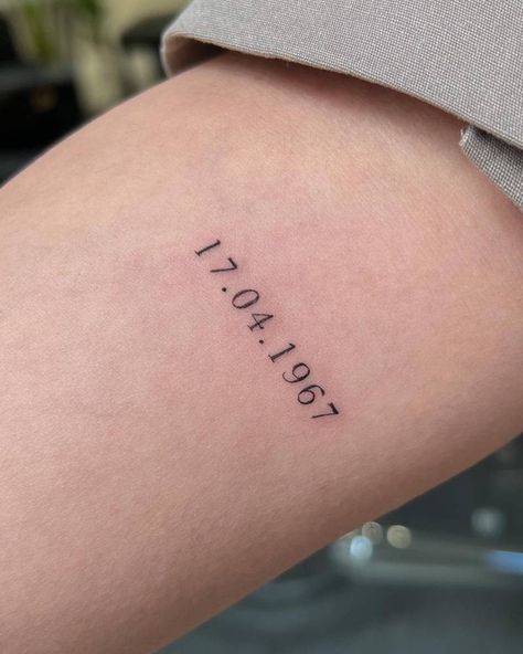 Arm Date Tattoos For Women, Tattoo Fonts Cursive Numbers, Mom Birthday Tattoo Ideas, Matching Tattoos Numbers, Sons Birthday Tattoo Ideas, Bday Date Tattoo, Tiny Date Tattoos For Women, Date Stamp Tattoo, Roman Numeral Placement Tattoo