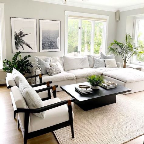 Quick Cleaning Tips to Rely On Before Guests Arrive | The Everygirl Black And White Aesthetic Living Room Minimalist, Black And Tan Coastal Decor, Coastal Living Room Black Accents, Black Beach House Interiors, Beach House With Black Accents, Florida Townhouse Interior Design, Black And White Beach House Living Room, Neutral Tropical Bedroom, Black Coastal Living Room