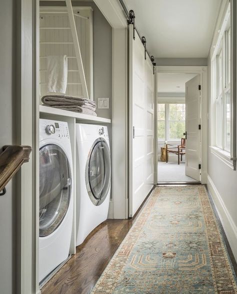 Barn doors are not just for barns anymore. From the countryside barns, these wide sliding doors have entered the house to become popular interior décor pieces. From cozy bedrooms to rustic home offices and perfect room dividers, barn-style doors are all the rage for homeowners. Farmhouse Laundry Room Ideas, Modern Farmhouse Laundry Room, Transitional Laundry Room, Drying Room, Hallway Closet, Laundry Room Doors, Laundry Room Closet, Carpet Pattern, Farmhouse Laundry