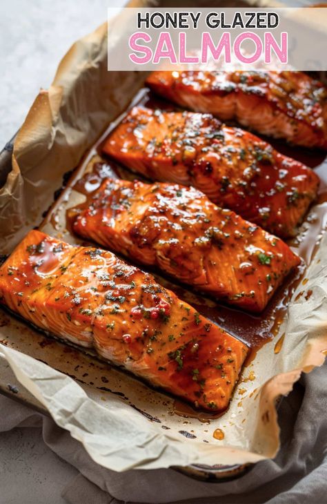 Get restaurant-quality honey glazed salmon at home! This recipe delivers tender, flavorful fish every time Cherry Chipotle Glazed Salmon, Honey Glaze Salmon Recipes, Honey Glaze For Salmon, Salmon Glaze Recipes Honey, Honey Roasted Salmon, Sweet Glazed Salmon, Steak Salmon Recipes, Baked Glazed Salmon, Oven Cooked Salmon Recipes