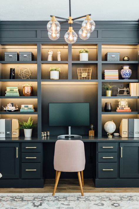 Love the back lighting in the shelving. I like the mixture of shelving widths and heights and the extra detail at the top. Fixture is cool but looking for something slightly more feminine. Home Office Desk And Bookshelves, Built In Shelving Lighting, Built In Shelves Desk Office, Desk Feature Wall, Built In Bookcase Desk Combo, Built In Desk Lighting, Desk In Shelves, Lights In Built In Shelves, Corner Bookshelf And Desk