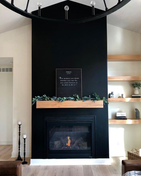 35 Amazing Black Fireplace Ideas To Inspire You Right Away Black Electric Fireplace Living Room, Black Wall Wood Mantle, Black Drywall Fireplace, Art Wall With Shelves, Black Stone Fireplace Wall, Dark Fireplace Accent Wall, Black Fireplace With Taupe Walls, Black Fireplace And Wall, Black Fireplace Design