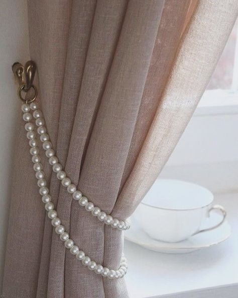 A curtain tieback is a decorative or functional accessory used to hold curtains or drapes to the side, allowing more light into the room or creating a decorative effect. They come in various styles and materials, like ropes, tassels, or metal hooks. They offer versatility in curtain styling, allowing you to change the look of the space by adjusting the position of the tiebacks or swapping them out for different styles. Overall, even though they are small details, curtain tiebacks can have... Curtains Holder, Instagram Decoration, Classy Rooms, Handmade Curtains, Plain Curtains, Curtain Holder, Curtains Holdbacks, Stylish Curtains, Metal Curtain