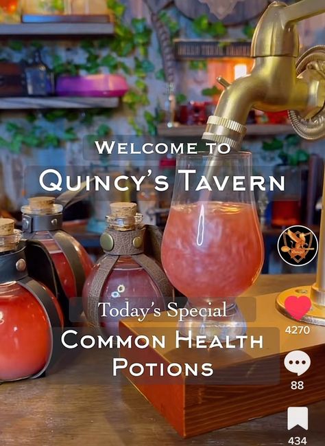 Pink drink pouring into small glass from faucet with glass travel flasks behind it D&d Cocktails, Dnd Themed Cocktails, Dungeons And Dragons Drinks, Dnd Mocktails, Dnd Themed Drinks, Dnd Drinks Recipes, Dnd Drinks Non Alcoholic, Dnd Themed Party, Dnd Drinks