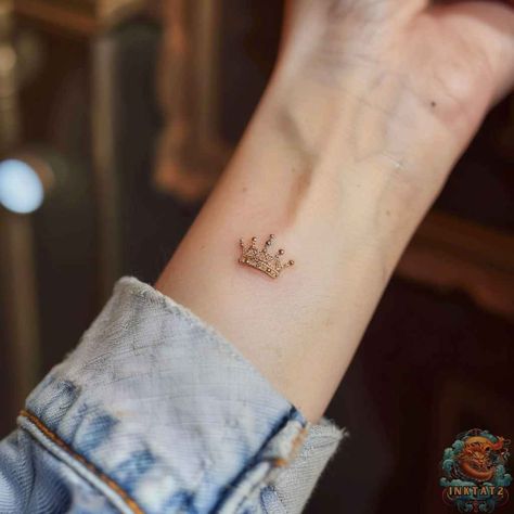 Unveiling the Symbolism: Exploring the Intricate Meanings of a Queen’s Crown Tattoo: 118 Designs - inktat2.com Queen Wrist Tattoo, Dainty Tiara Tattoo, Crown Finger Tattoos For Women, Flower Crown Tattoo, Queen Tattoo For Women, Crown Tattoos, Crown Tattoo On Wrist, Princess Crown Tattoos, Tiara Tattoo