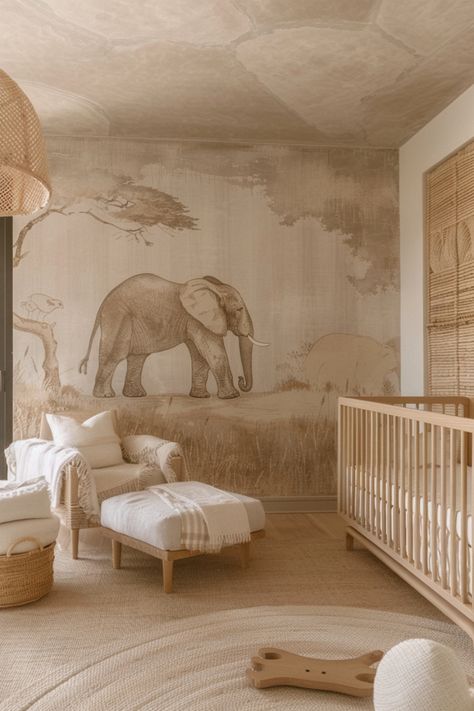 Safari nurseries evoke the thrill of the wild with playful animal prints, natural textures, and earthy hues. Click here for more inspiration. Safari Nursery Ideas, Modern Safari Nursery, Neutral Safari Nursery, Palm Print Wallpaper, Jungle Safari Nursery, Soft Blue Walls, Green Accent Pillow, Beige Nursery, Jungle Mural