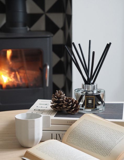 The fragrant sweetness of dewy bluebells, paired with timeless lily of the valley and fresh notes of persimmon. Our Scent Surround Diffuser looks elegant and stylish next to the fireplace, bringing a hint of luxury to a cosy backdrop. Image courtesy of @catesthill. #JoMaloneLondon #ScentsofHome Home Fragrance Photography, Diffuser Aesthetic, Aromatherapy Diffusers Aesthetic, Diffuser Photography, Reed Diffuser Photography Ideas, Reed Diffuser Aesthetic, Reed Diffuser Product Photography, Festive Fireplace, Sustainable Christmas Decorations