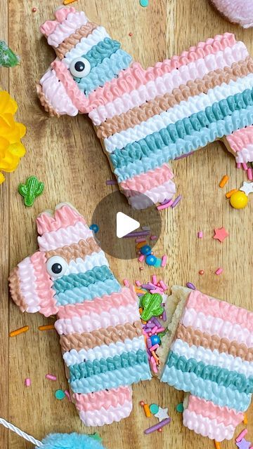 Mandy Edmunds on Instagram: "Make these amazing piñata cookies for your next fiesta and wow your friends! They’re so cute and easy! Here’s what you need:  🌵Two cookies (for the top and bottom) 🌵Royal icing, stiff consistency, in at least 3 different colors 🌵Sprinkles 🌵Sprinkle eyeballs 🌵Small, sharp knife 🌵Scissors  In this video, I show you how to cut a leaf tip from a tipless piping bag. This is a great way to add dimension to your cookie without having to use piping tips and couplers!  If you prefer, you can also make these cookies using just one cookie and laying a piece of rice paper over the sprinkle cavity before decorating.   I rolled my dough to 1/4” thick, so the finished cookie is about 1/2”.   ✨Happy Baking!✨  #sugaredupcookies   #customcookies #fiestacookies #pinatacooki Pinata Cookies Decorated, Piñata Cookies, Cookie Decorating Videos, Pinata Cookies, Royal Icing Decorated Cookies, Happy Birthday Cookie, Cookie Videos, Piping Bag, Cookie Tutorials