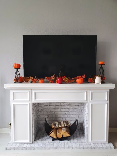 Diy Fireplace Ikea Hack, Fake Wall Fireplace, How To Make Faux Fireplace, Faux Fireplace Ikea Hack, Ikea Mantle Hack, Faux Fireplace Cabinet, Ikea Faux Fireplace, Ikea Hacks Fireplace, How To Make A Faux Fireplace Mantel