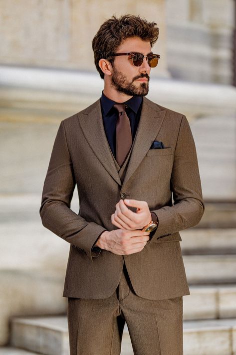 Elevate your formal attire with the Brown Slim-Fit Suit 3-Piece. This suit’s rich brown color and sharp, tailored fit provide the perfect balance of tradition and modernity, ensuring you stand out in any setting.  #brownslimfitsuit #elegantmenswear #classylook #formalfashion #modernfit #tailoredsuit #professionalstyle #sharpdressing #businessattire #menssuit Brown Suit Combinations Mens Fashion, Black And Brown Suit, Brown Suit Men, Brown Suit Wedding, Black Suit Designs, Wedding Guest Outfit Men, Brown Suits For Men, Urdu Vocabulary, Formal Attire For Men