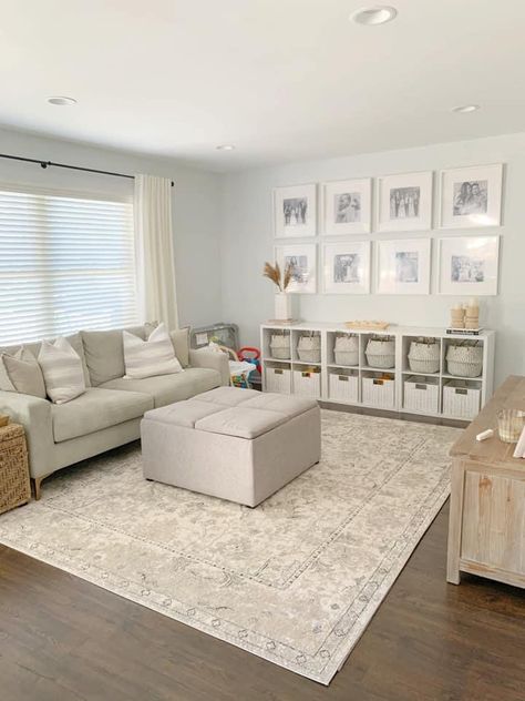 Small Basement Toy Room, Sitting Room Organization Ideas, Play Area In Front Room, Play Storage In Living Room, Playroom In Formal Living Room, Playroom Behind Couch, Playroom With Couch Layout, Organized Play Area In Living Room, Half Playroom Half Family Room