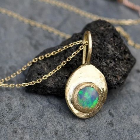 About this pendant: •.52 Australian Lightning Ridge black opal, 6 mm wide •Fully recycled 18k yellow gold with 14k rose gold accents on the chain • 1.1 mm wide solid 18k gold cable chain total 17.5” long including hook and eye •Available to purchase with or without the chain •Pendant is 21.02 mm long overall, 14 mm long not including loop bale #opal #blackopal #opalpendant #opalnecklace #opaljewelry #specimental #18k #18kgold #18kgoldjewelry #madeincanada Lightning Ridge Black Opal, Rose Gold Accents, 18k Gold Jewelry, Lightning Ridge, Hook And Eye, Opal Pendants, Opal Necklace, Chain Pendant, Black Opal