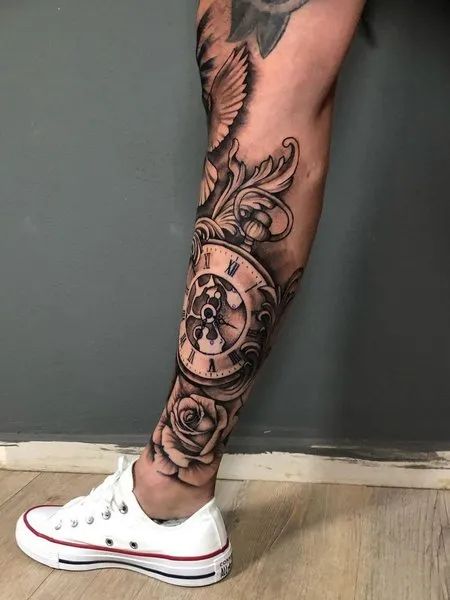 Clock Leg Tattoo Men’s Shin Tattoo Ideas, Clock Tattoo Design For Men Leg, Family Leg Tattoo Men, Clock Leg Tattoo Men, Bottom Leg Tattoo Men, Lower Leg Sleeve Tattoo Mens, Mens Tattoos Ideas Leg, Lower Leg Tattoo Sleeve, Family Leg Tattoo