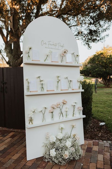 arched custom seating chart | Orlando Wedding Planner - Plan It Events | Captured by Carah Gideon Photography | www.planitcfl.com/blog | floral cocktail hour Wooden Arch Seating Chart, Wooden Arch Seating Chart Wedding, Seating Chart For Wedding Reception, Plywood Seating Chart Wedding, Garden Party Wedding Seating Chart, Seating Chart Arch, Shelf Seating Chart, Best Buds Seating Chart, Wedding Sitting Charts