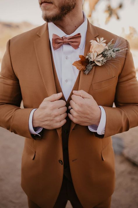 Desert Sage Bohemian Bridal Shoot in Joshua Tree - Hey Wedding Lady Rust Colored Groom Suit, Rust Suit Men Wedding, Copper Wedding Suit, Rust Wedding Suit Groom, Earth Tone Tuxedo Wedding, Mens Tuxedo Wedding Boho, Copper Suit Wedding, Boho Suits Men Groom Outfit, Terracotta Tuxedo Wedding