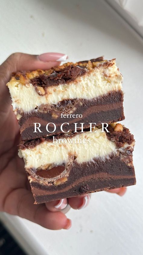 Ferrero Rocher Cheesecake Brownies – a divine fusion of fudgy brownies, velvety cheesecake, and the irresistible charm of crunchy Ferrero… | Instagram Chocolate Bar Brownies, Desert Bar Ideas, Showstopping Desserts, Ferrero Rocher Dessert, Ferrero Rocher Brownies, Birthday Dessert Ideas, Dipped Cheesecake, Candy Brownies, Ferrero Rocher Cheesecake