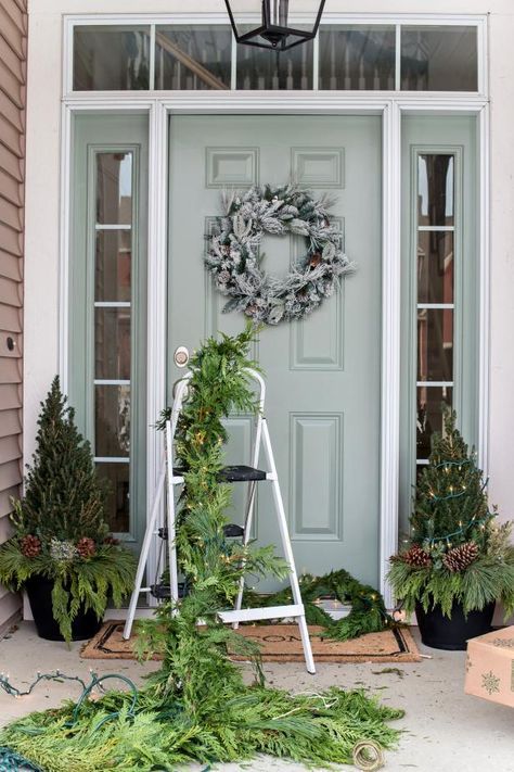 Front Porch Christmas Garland Ideas, Garland Around Front Door, Outdoor Christmas Garland, Porch Garland, Evergreen Garland, Elf On The Shelf Arrival, Outdoor Garland, How To Make Garland, Front Gardens