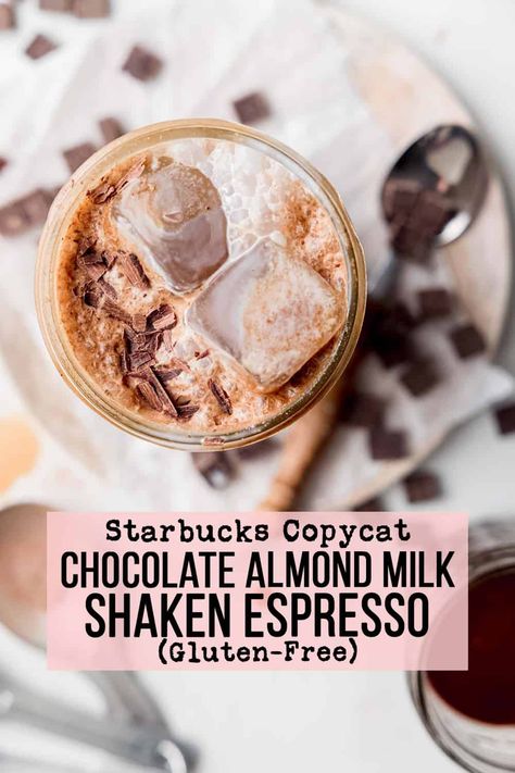 Looking for an easy, cost-effective way to enjoy your favorite Starbucks drink? Try this Copycat Iced Chocolate Almond Milk Shaken Espresso recipe made with only four ingredients - espresso or strong coffee, almond milk, hot cocoa mix, and ice! You'll get the same delicious taste as Starbucks at a fraction of the cost. Plus this recipe is gluten-free and can be made dairy-free or vegan as well! Chocolate Almond Milk Shaken Espresso, Almond Milk Hot Chocolate Recipe, Almond Milk Shaken Espresso, Califia Almond Milk, Shaken Espresso Recipe, Chocolate Coffee Drinks, Almond Milk Drinks, Diy Almond Milk, Espresso Recipe